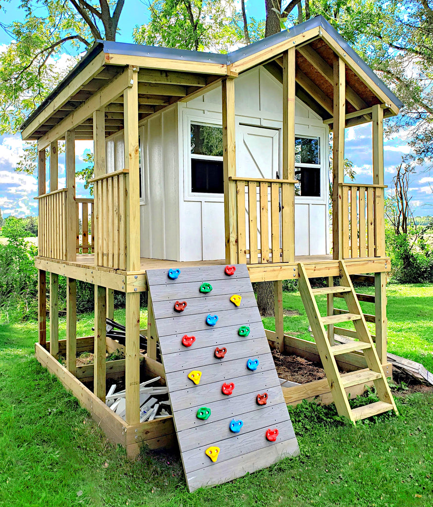 Elevated playhouse with "L" porch and rock wall