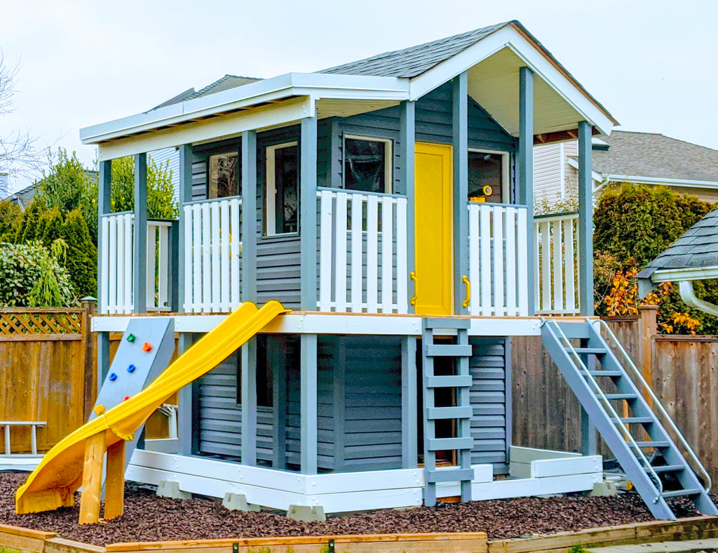 Two story, blue and yellow playhouse plan with wrap around porch and slide