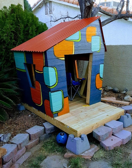 Colorful, crooked kid's playhouse made for toddlers