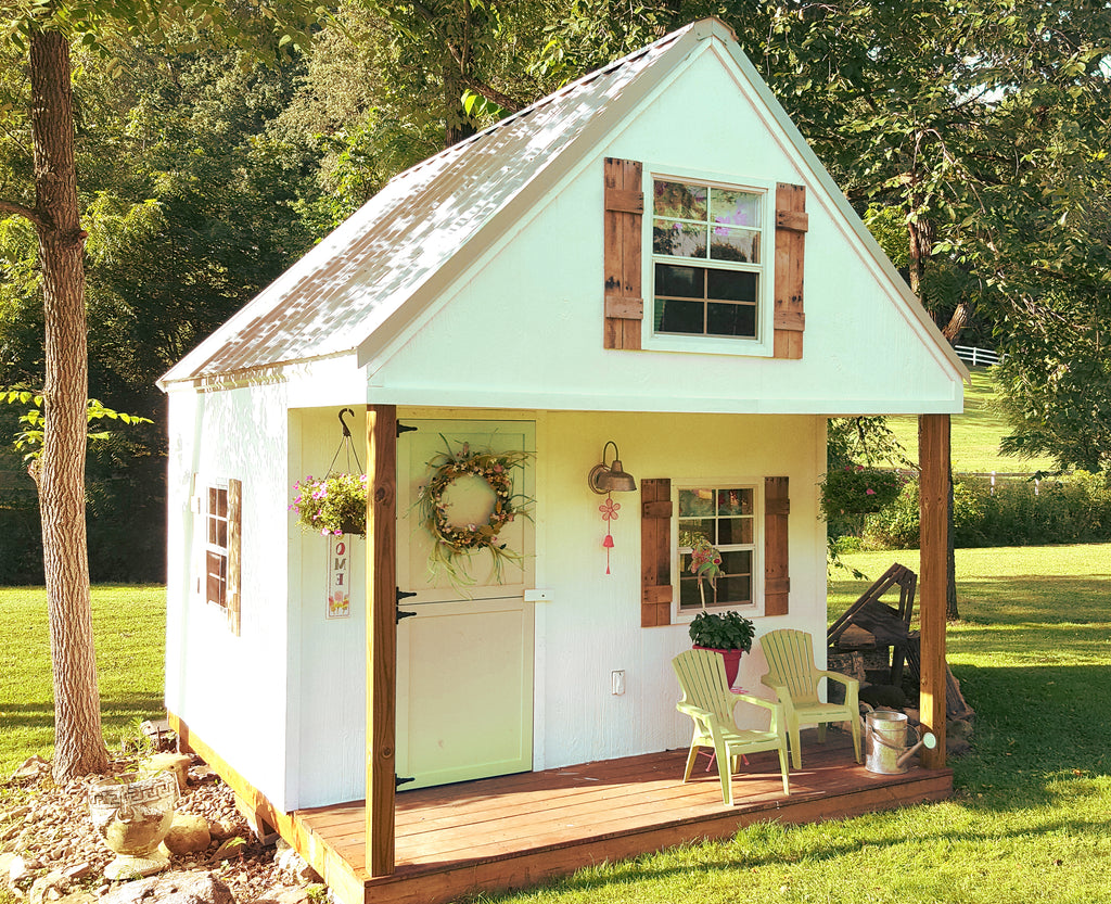 pretty outdoor playhouse with loft