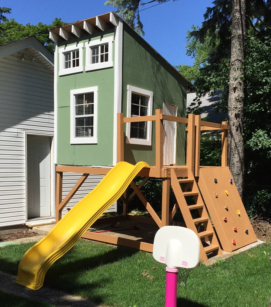 cool kids clubhouse with shed roof, slide and rock wall