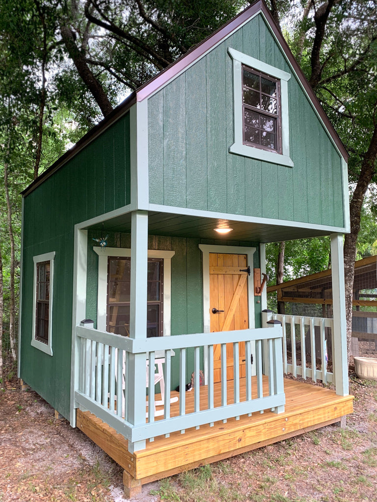 Green gable playhouse with porch and overhead loft