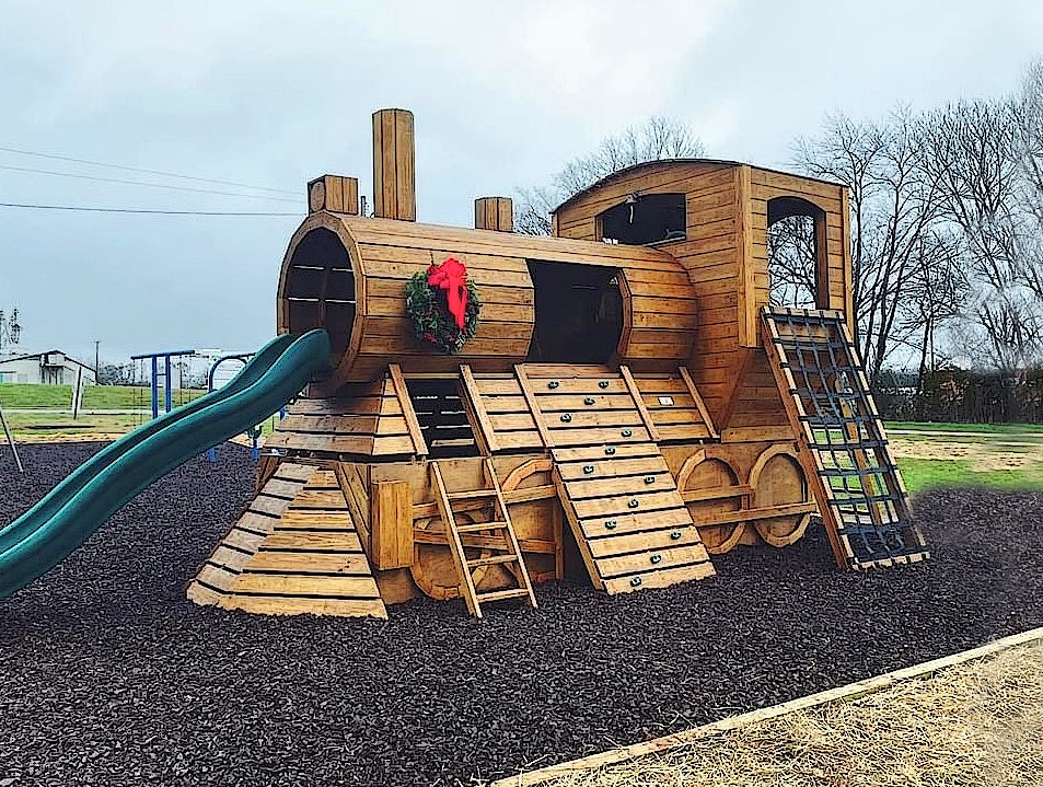 Large wooden train playground playset with slide, rock climb and Christmas reef.