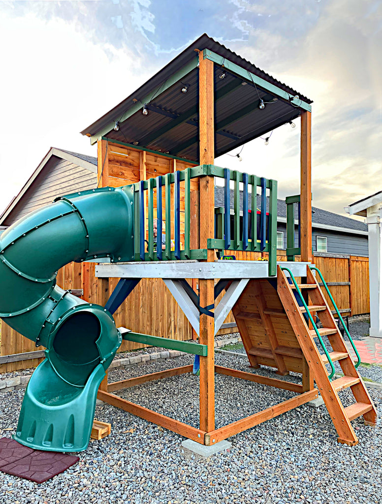 Open playset design with spiral slide and little boy playing