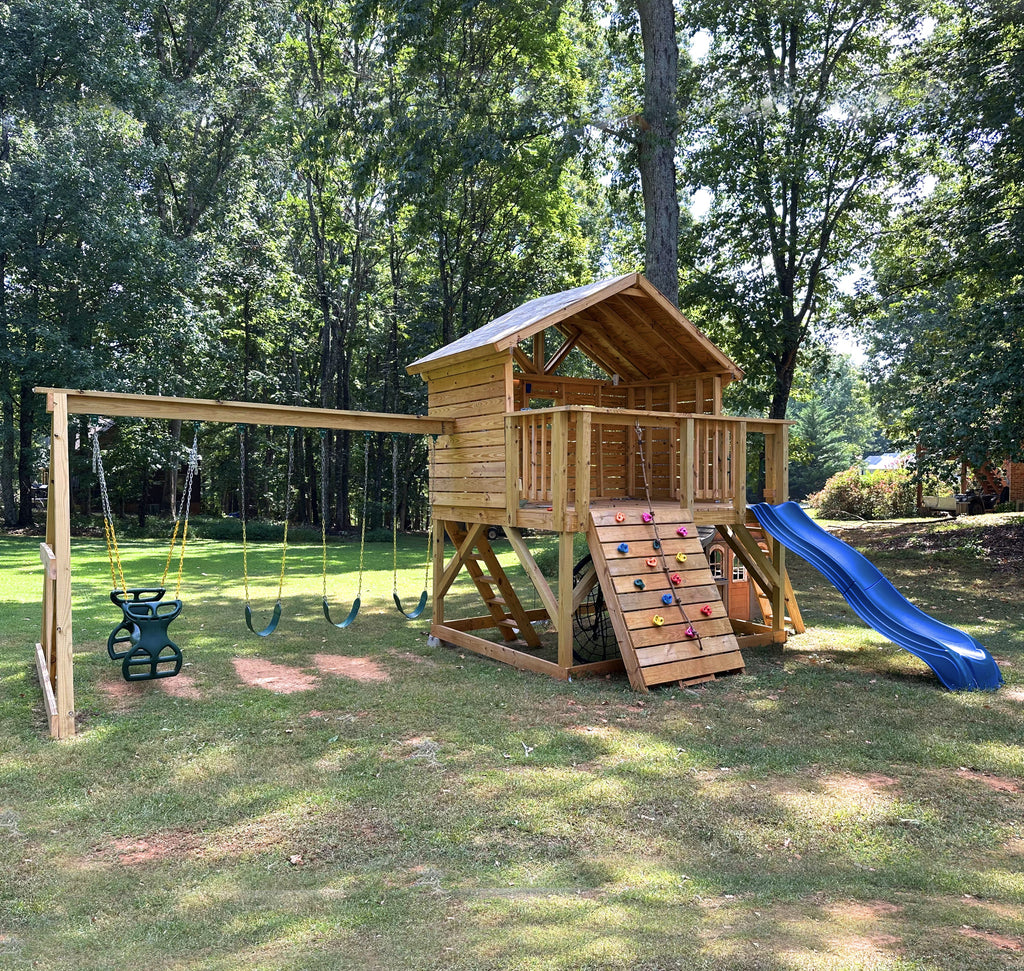A open gable playset in a backyard with swingset and slide