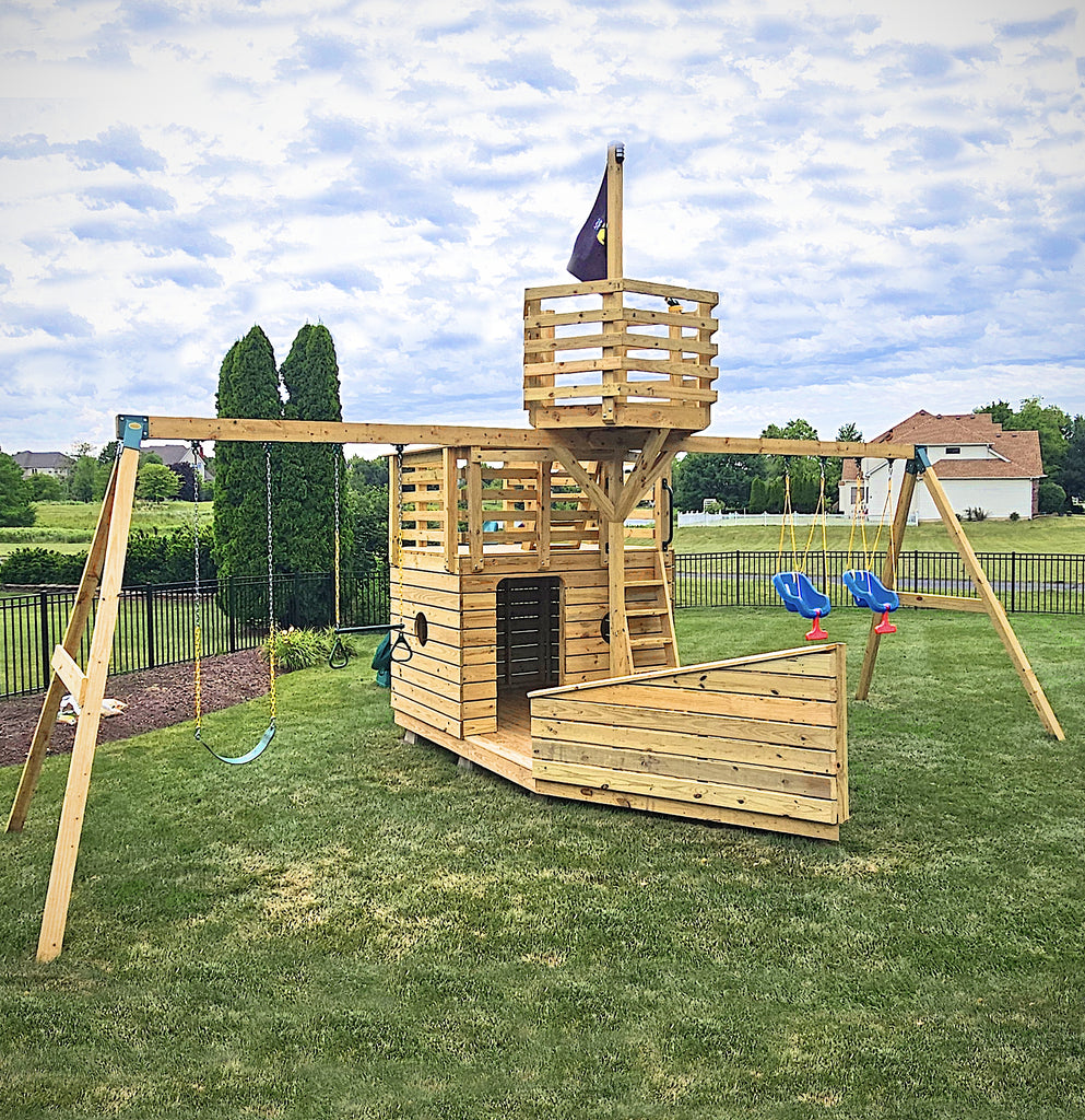 Compact, wooden backyard pirateship with dual swingsets and crow's nest.