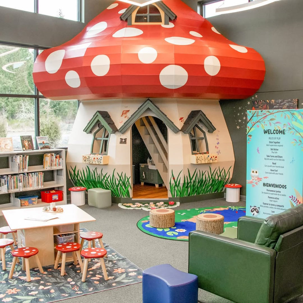 Large toadstool playhouse inside a library.