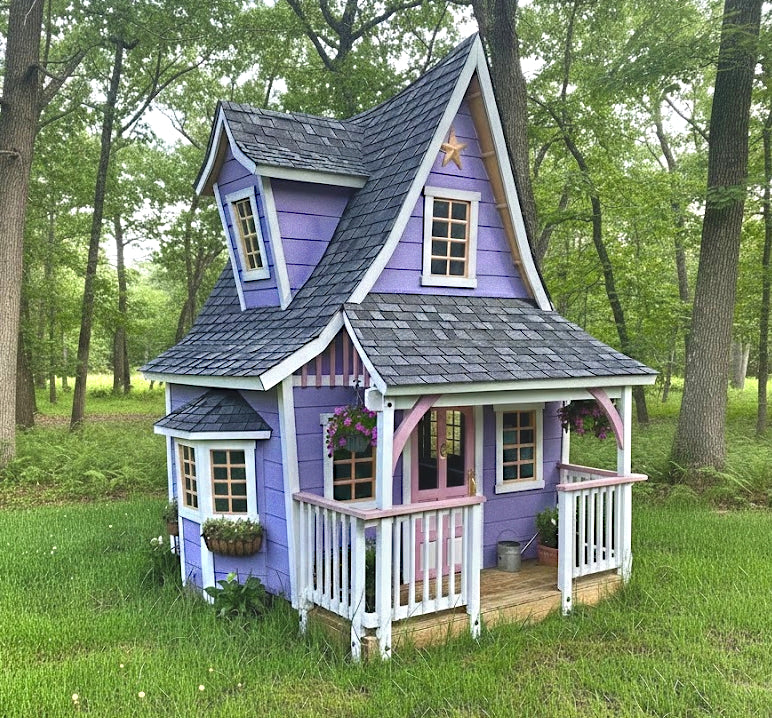 Purple children's playhouse with a gray roof in a forest setting