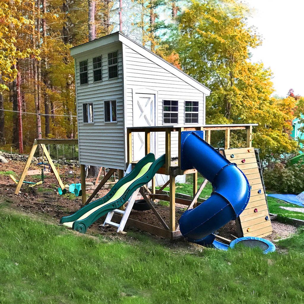 White, lean-to kid's clubhouse with loft, swingset, spiral slide and rockwall