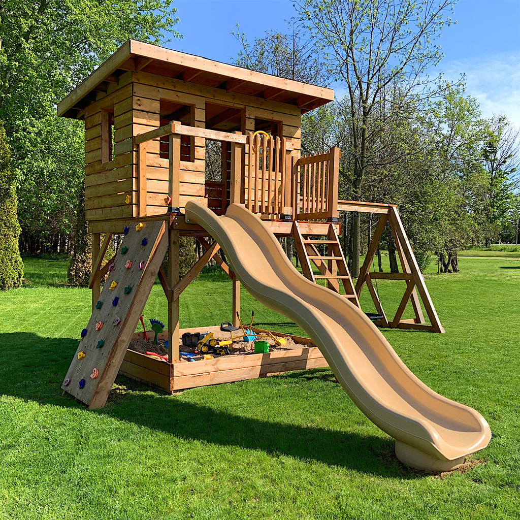 Wooden, elevated backyard clubhouse with porch, slide, rockwall, swingset and sandbox