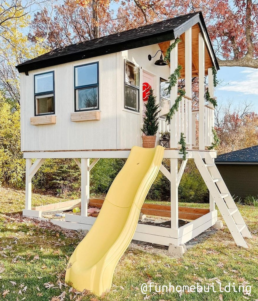 whiate gable playhouse with porch on stilts