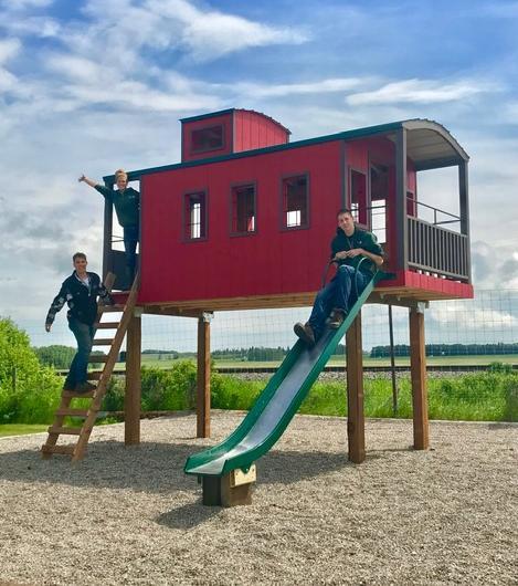 Elevated red caboose play-set with slide