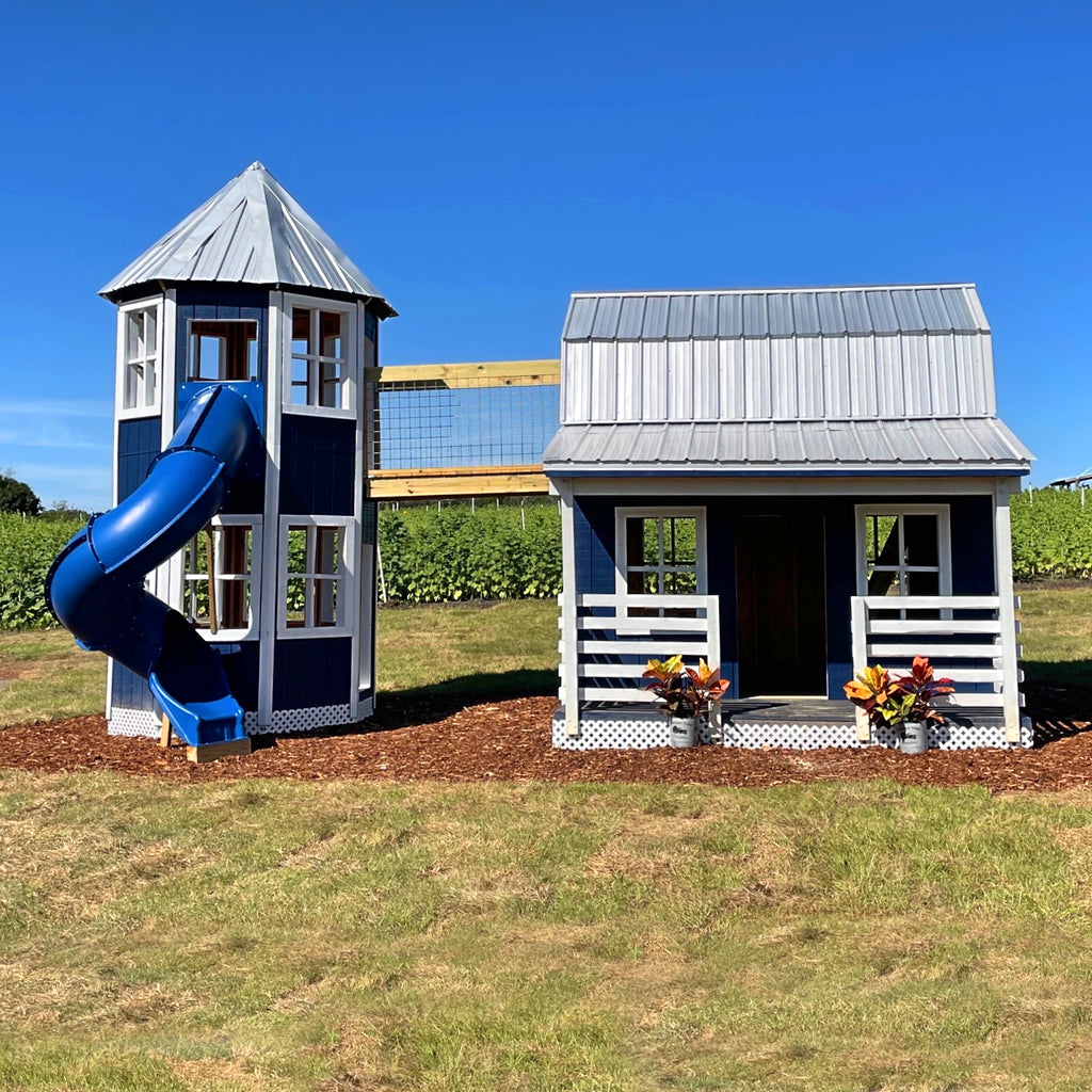 Blue barn and silo playset with spiral slide on farm