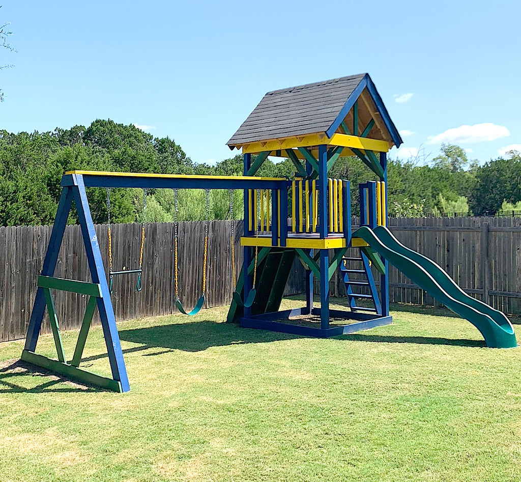 Blue and yellow backyard playset on posts with swingset