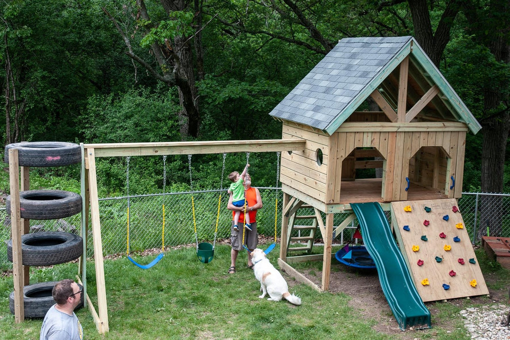 DIY backyard play-set plan with tire tower and rock wall