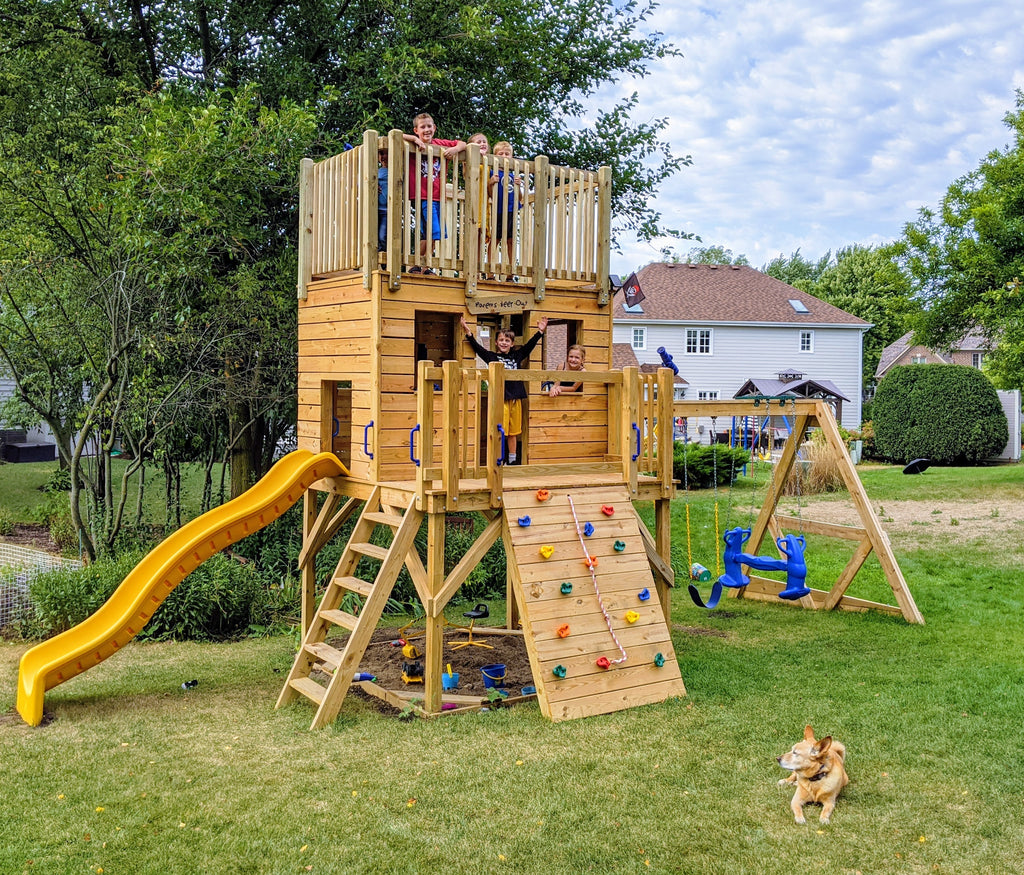 Group of kids playing on backyard, 3 level playset with swing set and slide