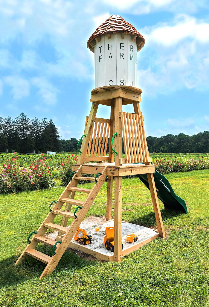 Wooden water tower playset with sandbox and slide
