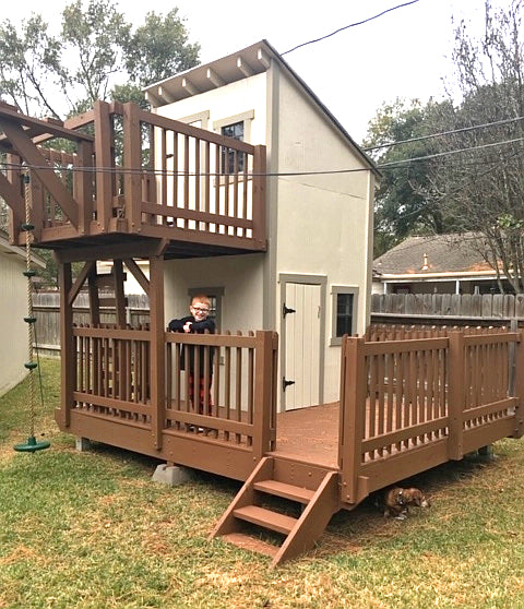 A two level, porch and balcony playhouse
