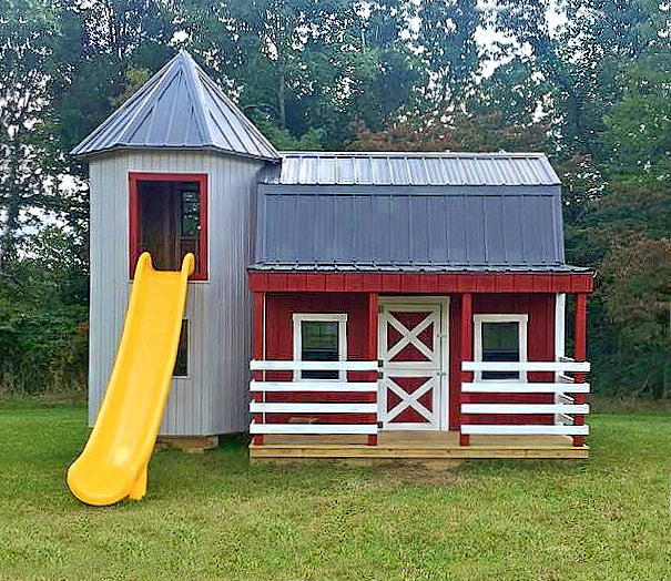 A barn and silo, two story outdoor playhouse playset